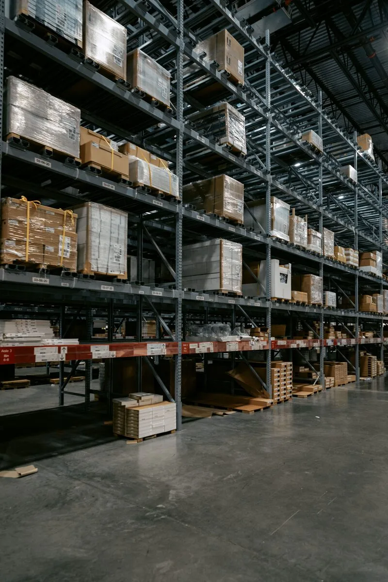 Tall warehouse racks holding organized commercial inventory
